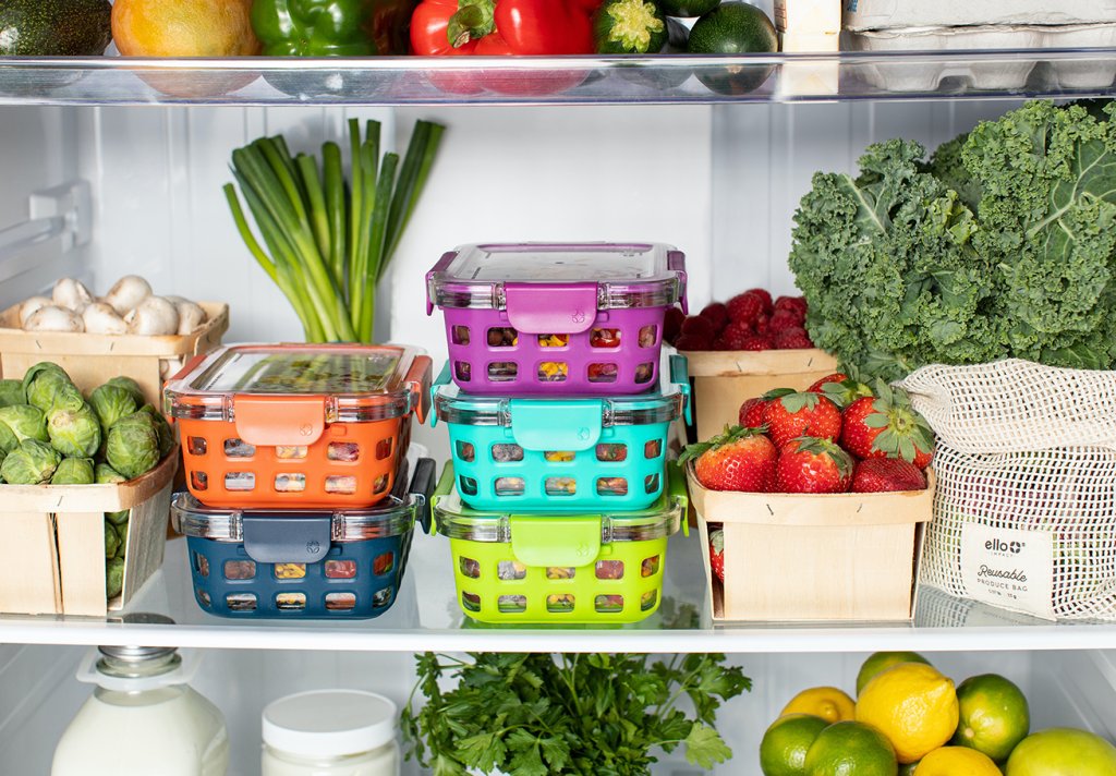 Various food storage containers inside a fridge. Photo by Ello on Unsplash.