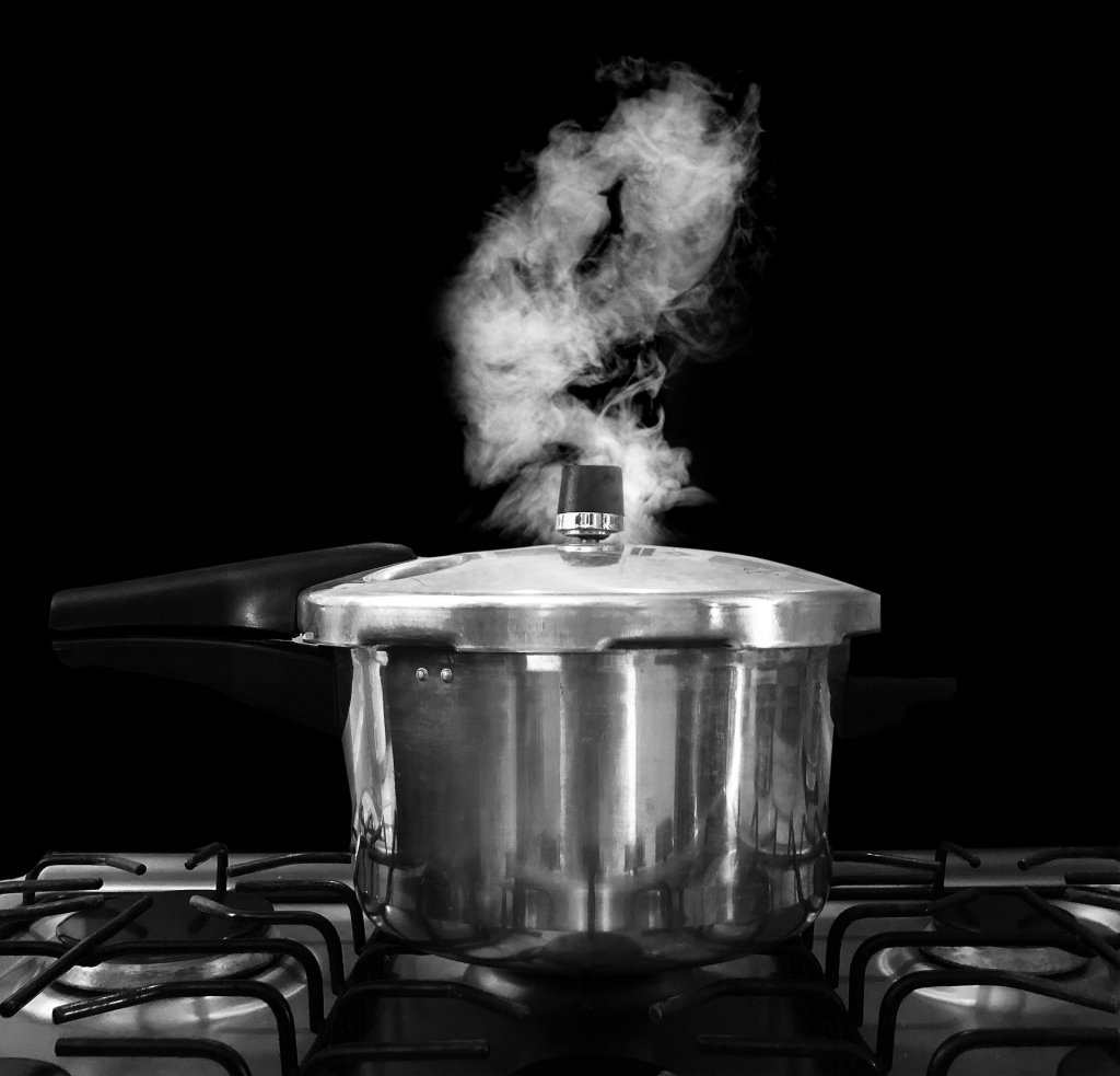 Pressure-cooking put on gas stove. Image by Pixabay.