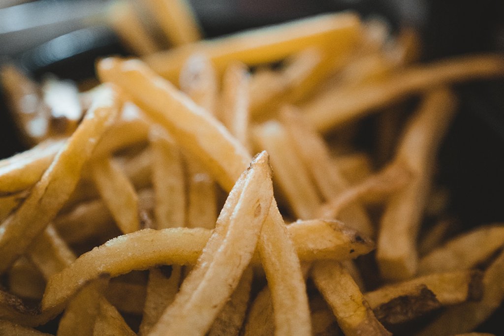 Fried chips or potato fries. Photo by Mehrshad Rajabi on Unsplash.