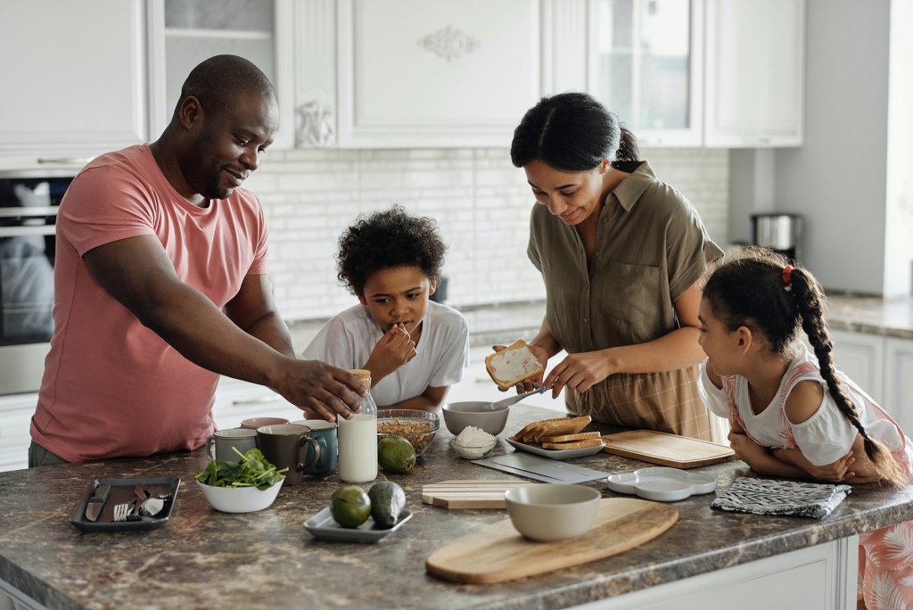 Family making breakfast in the kitchen. Photo by August de Richelieu of Pexels.