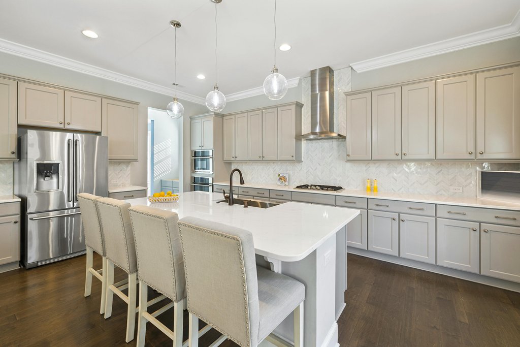 White kitchen cabinets. Photo by Curtis Adams on pexels.com.