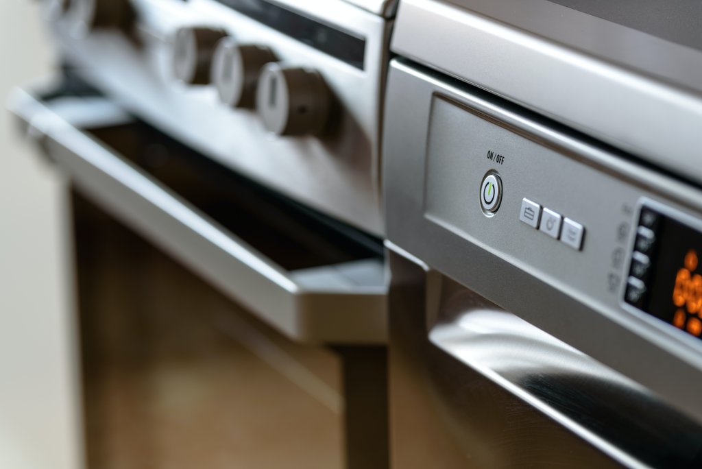 Closeup of a dishwasher and oven kitchen appliance. Photo by PhotoMIX.